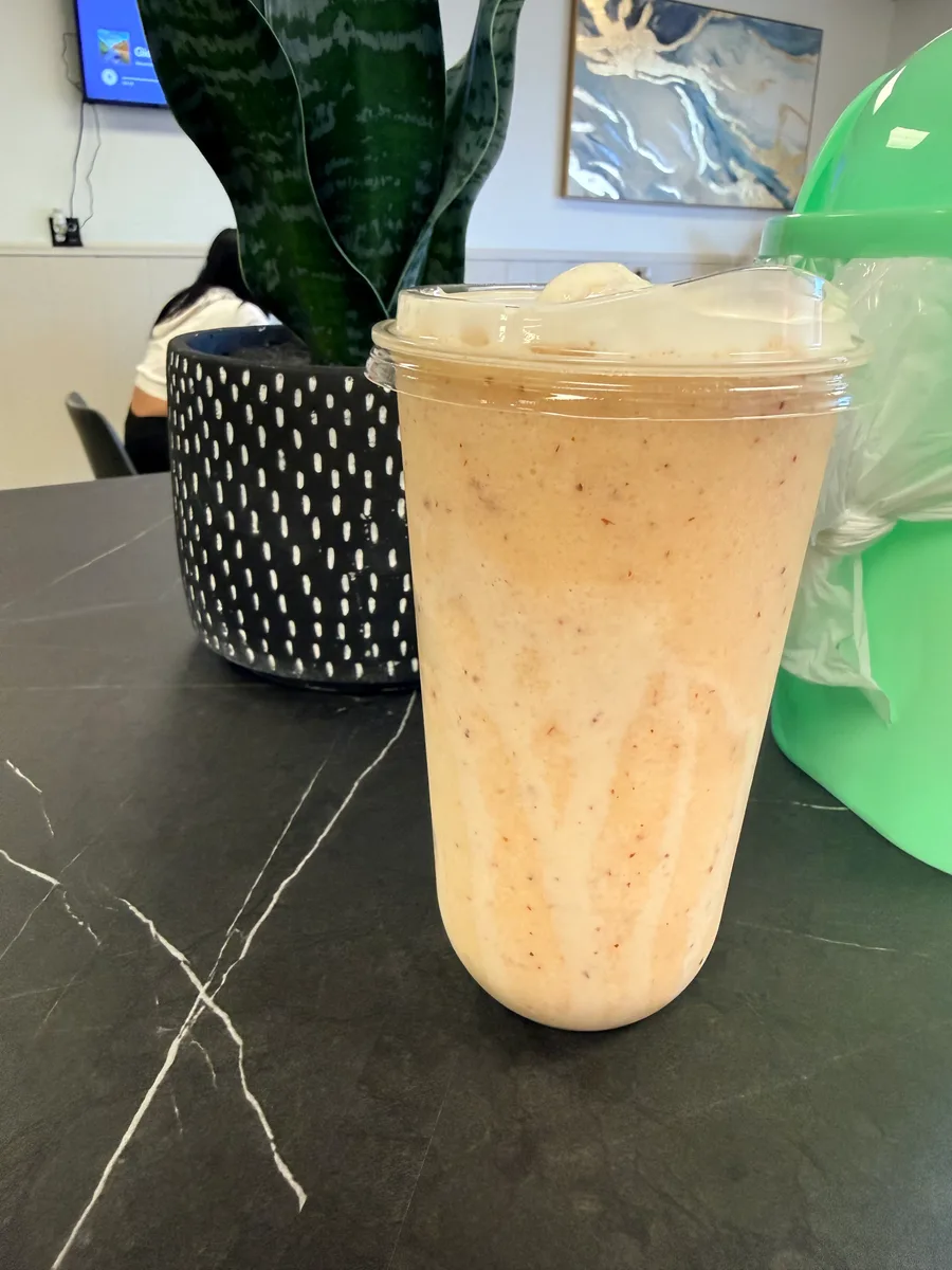 Colorful smoothie lineup at Top it off